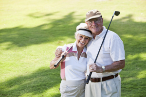 Senior couple playing golf